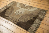 Vintage Oushak rug's secured side border with geometric patterns and pale blush.