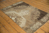 Vintage Oushak rug corner, geometric border with stylized vinery in coffee brown tones.