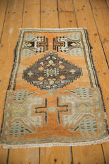 Distressed low pile, vintage Oushak rug, geometric cross motif, pale orange, mint.