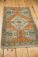 Distressed vintage Oushak rug border and floral details in rust, ivory, mint, turquoise.
