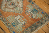 Distressed Oushak rug corner, short fringe, low pile, rust, ivory, oxidized silver patterns.