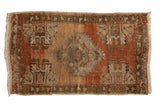 Vintage distressed Oushak rug, hand-knotted, with stepped medallion and germinating plants.