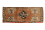Vintage distressed Oushak runner with stepped floral medallion, terra cotta rust, charcoal, beige. 1'6