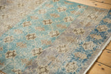 Distressed vintage Sparta rug, soft aqua, grey, and ivory abrashes with muted floral lattice pattern.