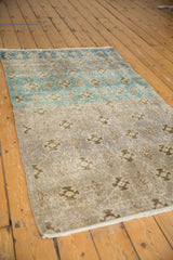 Vintage Distressed Sparta rug with visible abrashes, muted silver, grey, and brown tones.