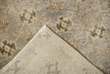 Hand-knotted foundation and fringed edge of vintage Sparta rug, with worn floral motifs.
