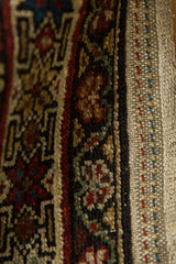 Hand-knotted border and fully secured side finish on an antique Persian Malayer collector rug.
