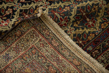 The finely knotted reverse and low pile of a collector's antique Persian Malayer rug.