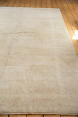 Distressed low pile and ivory, platinum tones of the vintage Oushak carpet.