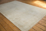 Distressed pile texture with muted ivory and platinum shades of a vintage Oushak rug.