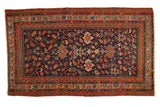 Antique Serbend rug, navy blue field, terracotta borders, allover splayed floral and boteh motifs, early 20th century.