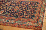 Intricate ivory and madder red borders on antique Serbend rug corner with secured fringe.