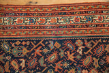 Antique Serbend rug border and field with splayed floral, boteh motifs in rich shades.
