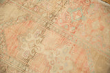 Distressed vintage Oushak rug: blush, pale aqua, sand tones with latch and floral patterns.