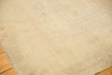 Evenly worn low pile showing the hand-knotted texture of a vintage Oushak carpet.