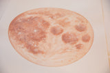 Warm moon painting with textured reddish-brown craters and bright surface highlights.