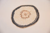 Textured cream and reddish core of Katelyn Morse painting with dark irregular edge.