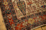 Intricate brick red and dark blue borders, ivory ground, and wear on an antique Afshar rug.