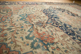 Intricate floral vinery and field detail on an antique Persian Farahan Sarouk carpet, revealing rich abrashes.
