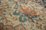 Antique Farahan Sarouk carpet with intricate floral vinery, visible abrashes, dusty teal, and blush.