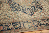 Antique Farahan Sarouk rug detail: intricate floral vinery, abrash, and visible pile wear.
