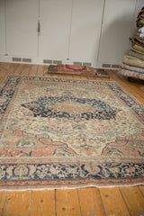 Antique Farahan Sarouk carpet end with secure fringe, intricate navy and rose borders.