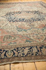 Antique Farahan Sarouk's navy, ivory, dusty rose floral vinery shows notable pile wear.