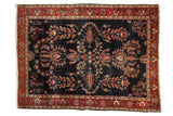Antique Mohajeran Sarouk rug, deep navy field with bursting florals and wine red palmette border.