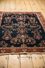 Fringe and red main border with unique palmette design on an antique Mohajeran Sarouk rug.