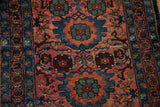 Dusty raspberry red vintage Lilihan runner with sky blue floral motifs and vinery.