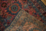 Vintage Lilihan runner folded, showing dusty raspberry floral face and woven foundation.