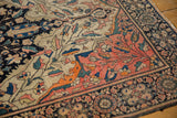 Antique Farahan Sarouk rug with blush palmette border, delicate vinery, and navy accents.