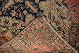 Antique Farahan Sarouk rug's blush palmette border revealing hand-knotted foundation in ivory.