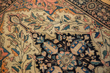 Intricate vinery and palmette pattern in ivory, blush, navy, tangerine, showing even wear.