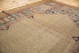 Antique Serab rug's Herati corner spandrel, wide banded border, and beige lattice field with shadow design.
