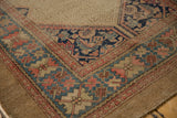 Antique Serab rug corner detail showing Herati spandrel, wide border in beige, blue, blush tones.