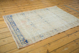 Textured vintage Oushak rug featuring fantastic abrashes, soft ivory, apricot, and navy cobalt tones.