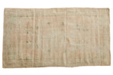 Vintage Distressed Oushak rug, ivory and pale beige field, faded aqua floral medallion design.