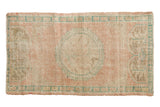 Hand-knotted Oushak rug with distressed pale pink, green scalloped medallion, 2'4