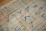 Distressed Oushak rug with even wear, faint foundation, ivory, navy, pink, and sage.
