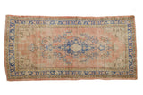 Vintage distressed Oushak runner with blue Rococo-style medallion, dusty blush, 2'11