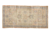 Vintage distressed Oushak runner, ivory and beige, with an oversized floral medallion, dusty blue border, 2'1