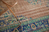 Vintage Distressed Oushak rug detail showing worn dusty rose field and blue palmette border.