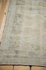 Distressed texture of a vintage Oushak rug runner with even wear to knot heads.