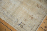 Textured pile of a distressed Oushak rug, showing visible foundation and subtle pale patterns.