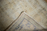 Distressed Oushak runner pile texture with foundation showing, folded to reveal colorful backing.