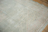 Textural close-up of the distressed vintage Oushak rug pile, showing wear to knot heads.