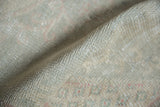 Vintage distressed Oushak rug pile with soft texture and mostly wear to knot heads.