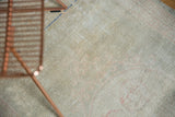 Textured distressed vintage Oushak rug runner with subtle seafoam and ivory tones.