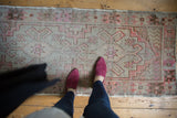 Distressed Oushak runner showing faded blush and silver tones, even pile wear.